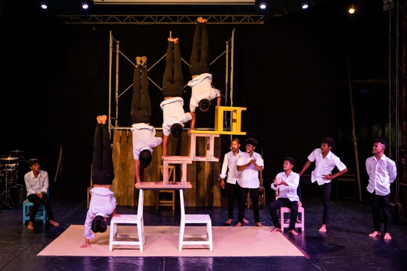 Circus students on stacked chairs in Battambang, Cambodia