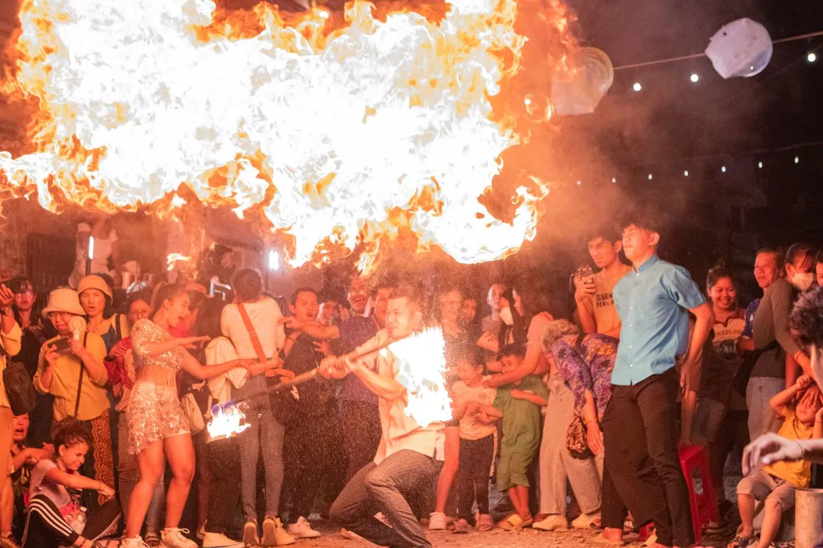 A circus performer shoots fire during the opening ceremony of S'Art festival