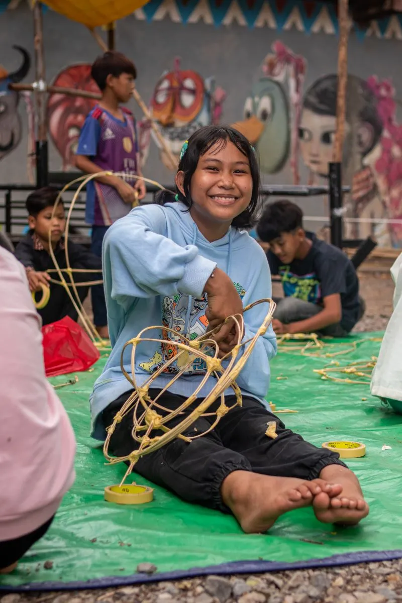 A girl participates in the Giant Puppet Project workshop