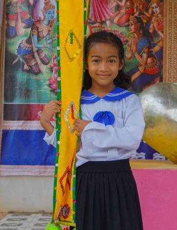 a Phare Kindergarten student celebrating Pchum Ben Festival