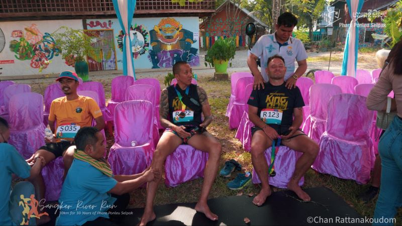 The finish line massage after the Sangker River Run in Battambang, Cambodia