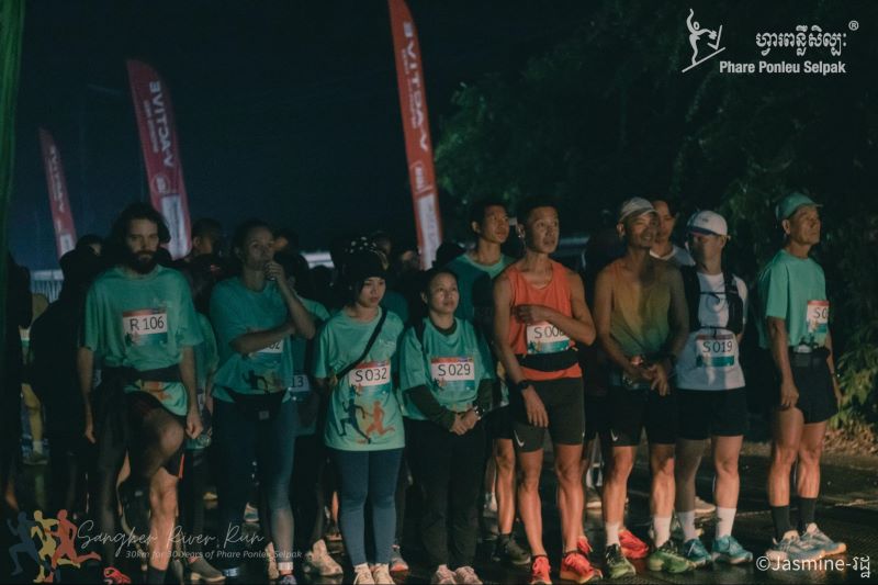 Runners line up at the starting line of the the Sangker River Run in Banan, Cambodia