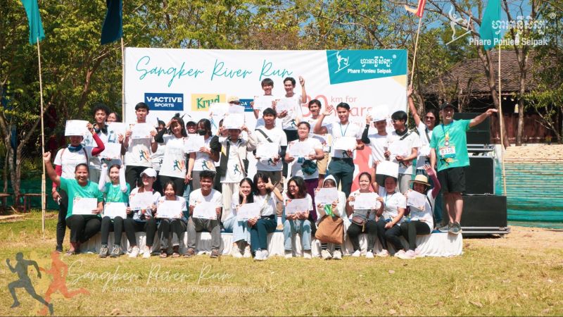 Volunteers for the Sangker River Run in Battambang, Cambodia posing on the campus of Phare Ponleu Selpak